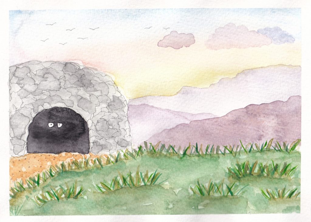 A mysterious picture of a cave with eyes glaring in the darkness. Surrounding the cave are hills in the distance and a green field in the foreground